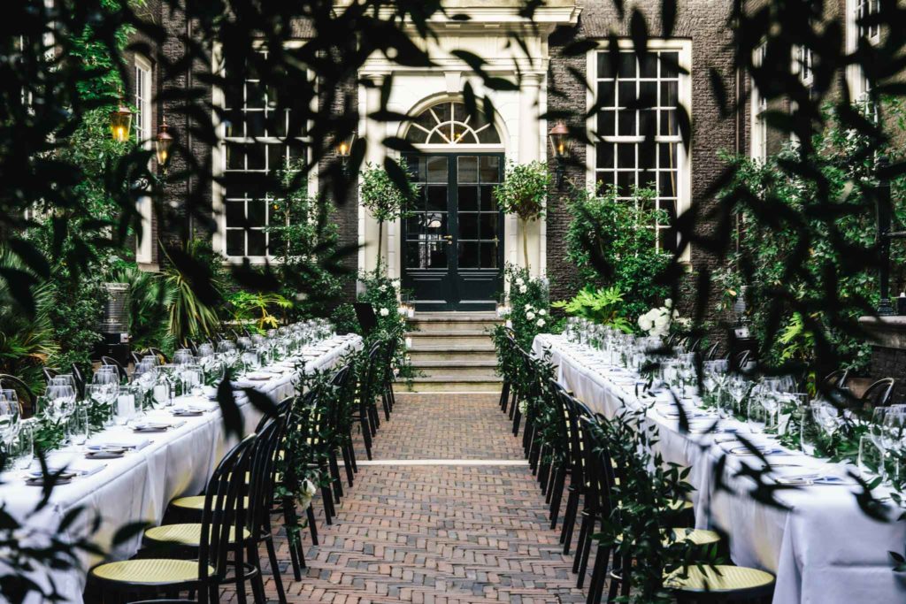 The secluded garden set for a dinner at a wedding at luxury boutique hotel Royal Gate Resort.