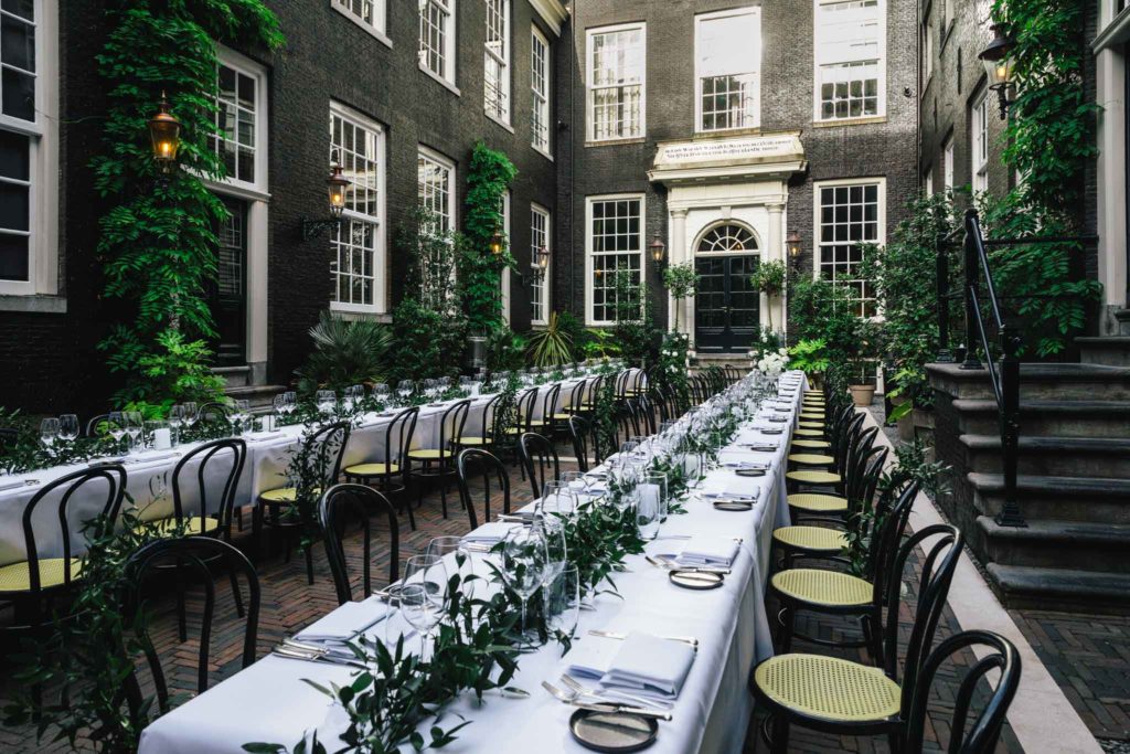 The secluded garden set for a dinner at a wedding at luxury boutique hotel Royal Gate Resort.