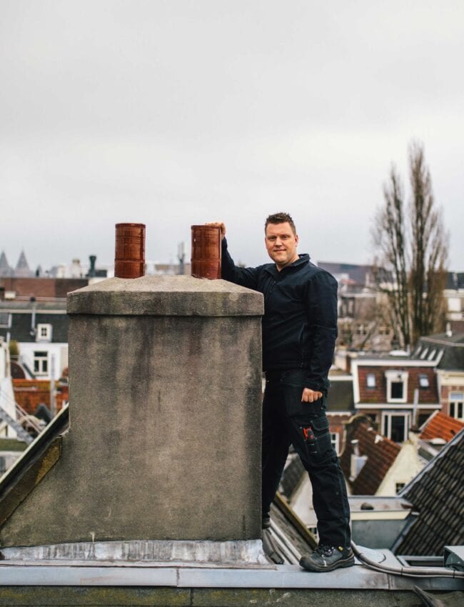 Chief engineer, luxury boutique hotel Amsterdam, Royal Gate, Posing next to the chimney on the roof.